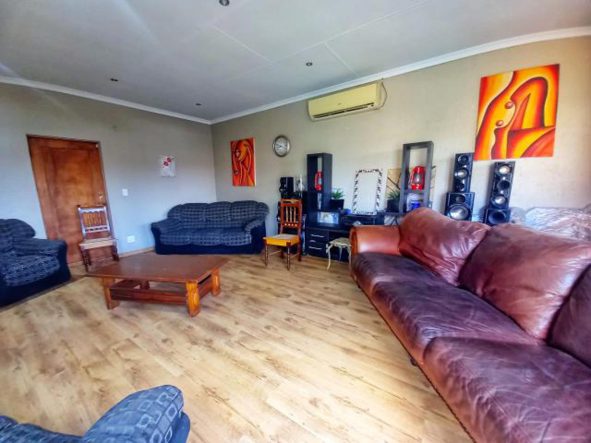 Lounges of property in Pretoria Gardens